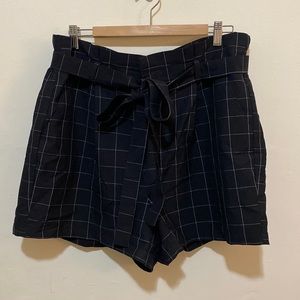 Black high-waisted paper bag shorts